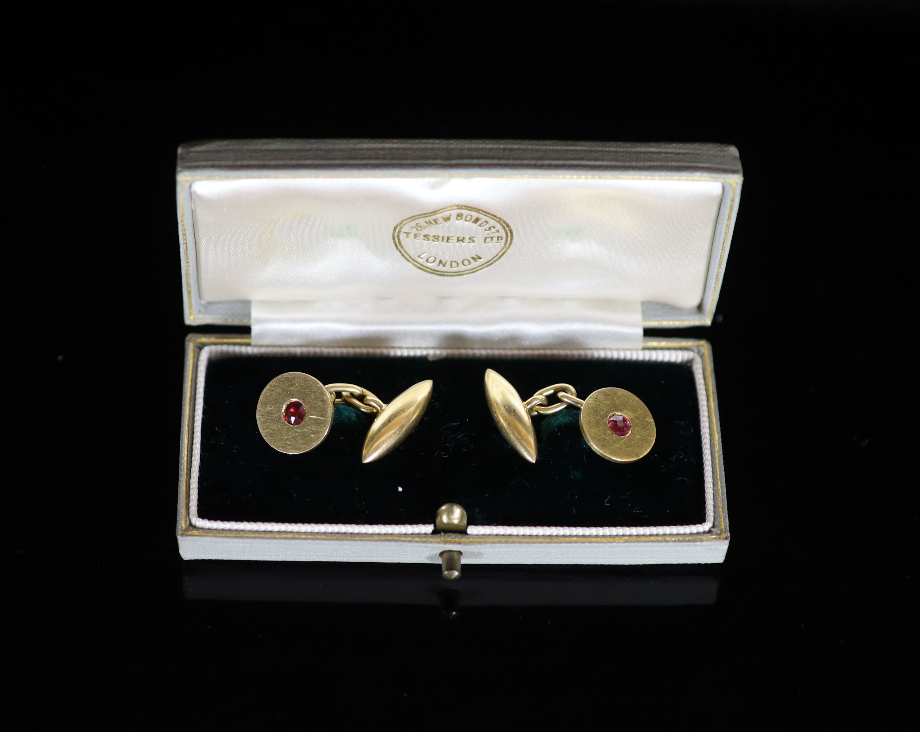 A pair of 18ct gold and ruby set disc cufflinks